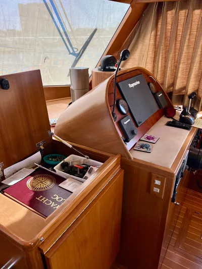  Yacht Photos Pics 2008 Island Pilot 435 yacht helm with navigation equipment and storage compartments.