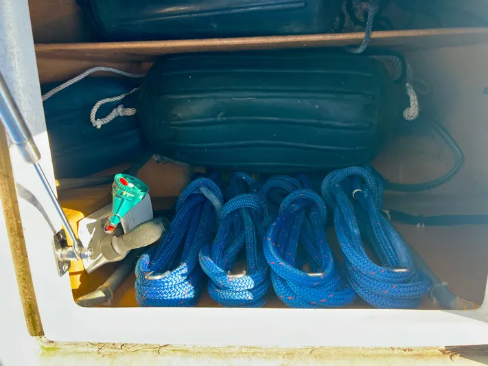  Yacht Photos Pics Storage compartment on a 2008 Island Pilot 435 with blue ropes and fenders.
