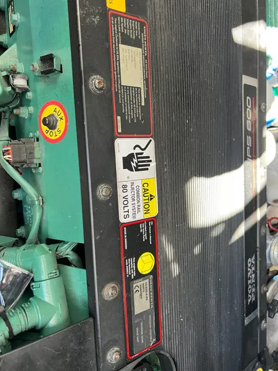  Yacht Photos Pics Engine compartment of a 2008 Island Pilot 435 with caution labels and components.