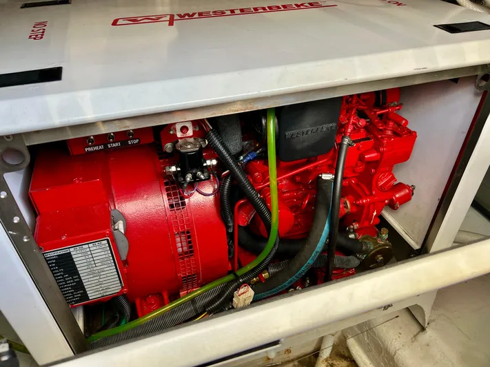  Yacht Photos Pics Red Westerbeke generator inside a 2008 Island Pilot 435 boat engine compartment.