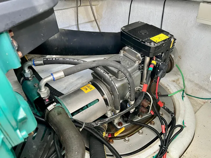  Yacht Photos Pics Engine compartment of a 2008 Island Pilot 435 boat, showcasing mechanical components and wiring.