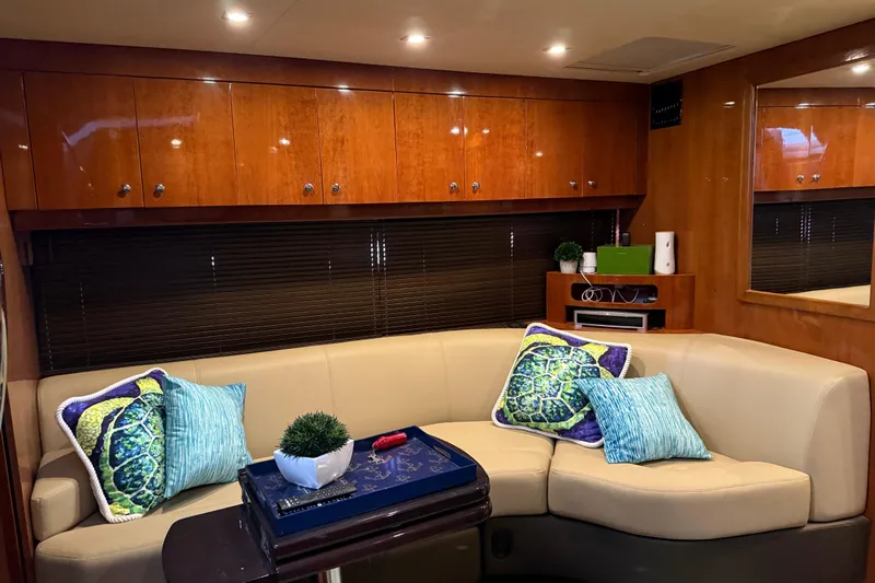  Yacht Photos Pics Luxurious interior of 2012 Regal 46 Sport Coupe with plush seating and vibrant cushions.