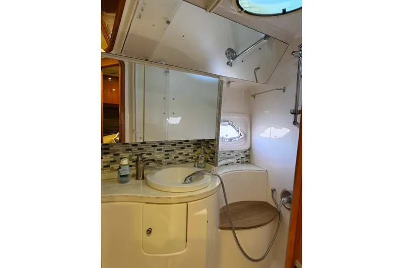  Yacht Photos Pics Luxurious bathroom in 2012 Regal 46 Sport Coupe yacht with modern fixtures and elegant design.