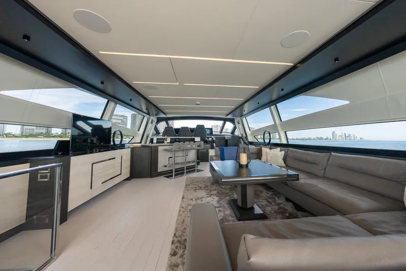 Vintage Yacht Photos Pics Luxurious interior of 2021 Pershing 9X yacht with modern furnishings and panoramic windows.