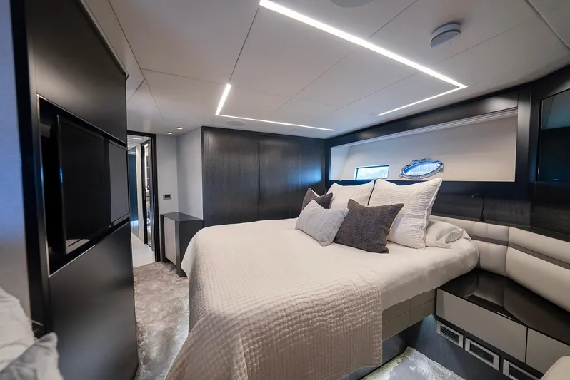 Vintage Yacht Photos Pics Luxurious bedroom interior of 2021 Pershing 9X yacht with modern design and elegant furnishings.