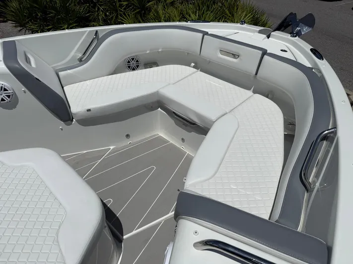  Yacht Photos Pics 2025 Wellcraft 38 T-Top boat interior with white cushioned seating and sleek design.