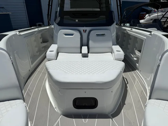  Yacht Photos Pics 2025 Wellcraft 38 T-Top boat interior with cushioned seating and sleek design.