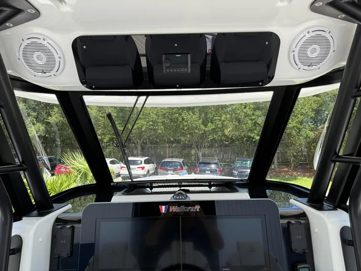  Yacht Photos Pics 2025 Wellcraft 38 T-Top boat interior with advanced dashboard and speakers.