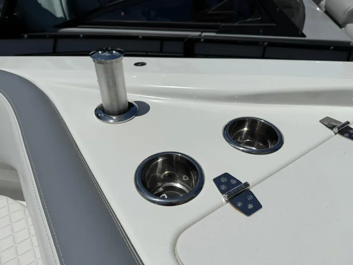  Yacht Photos Pics 2025 Wellcraft 38 T-Top boat detail with cup holders and stainless steel fittings.