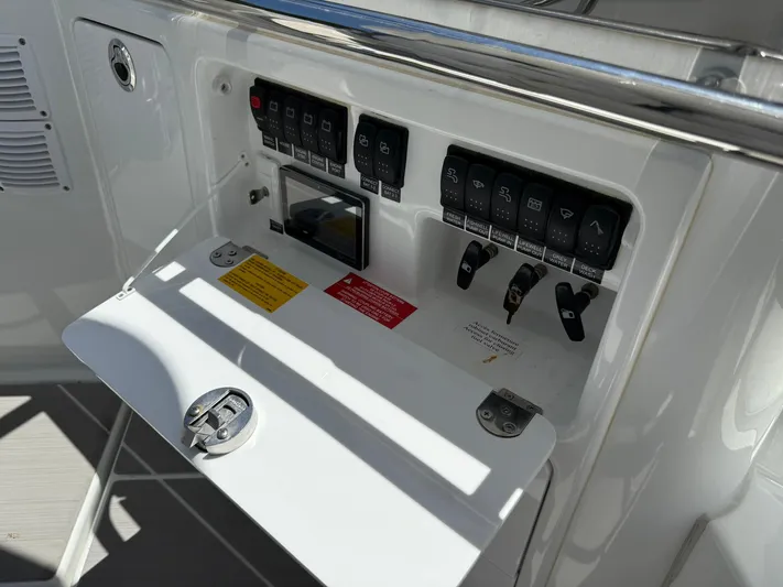  Yacht Photos Pics Control panel of 2025 Wellcraft 38 T-Top boat with switches and labels.
