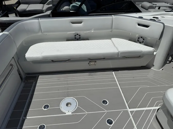  Yacht Photos Pics 2025 Wellcraft 38 T-Top boat interior with white seating and modern deck design.