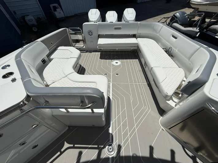  Yacht Photos Pics 2025 Wellcraft 38 T-Top boat interior with luxurious seating and modern design.