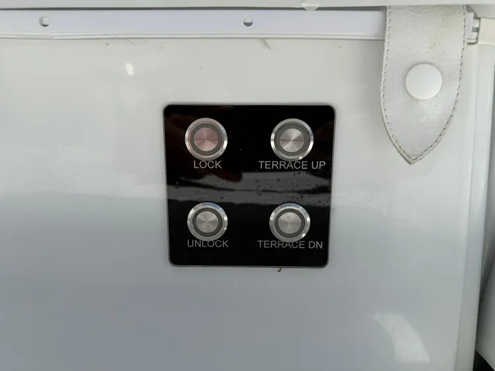  Yacht Photos Pics Control panel on 2025 Wellcraft 38 T-Top boat with lock and terrace buttons.
