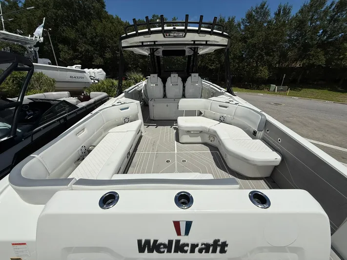  Yacht Photos Pics 2025 Wellcraft 38 T-Top boat interior with spacious seating and modern design.