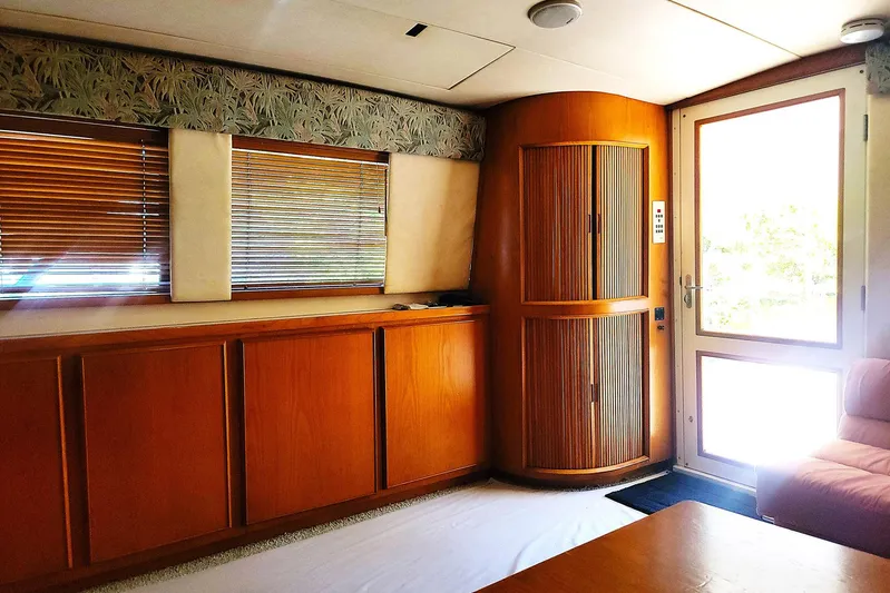 Trophy Hunter Yacht Photos Pics Interior of 1989 Bertram 50 Convertible yacht with wooden cabinets and blinds.