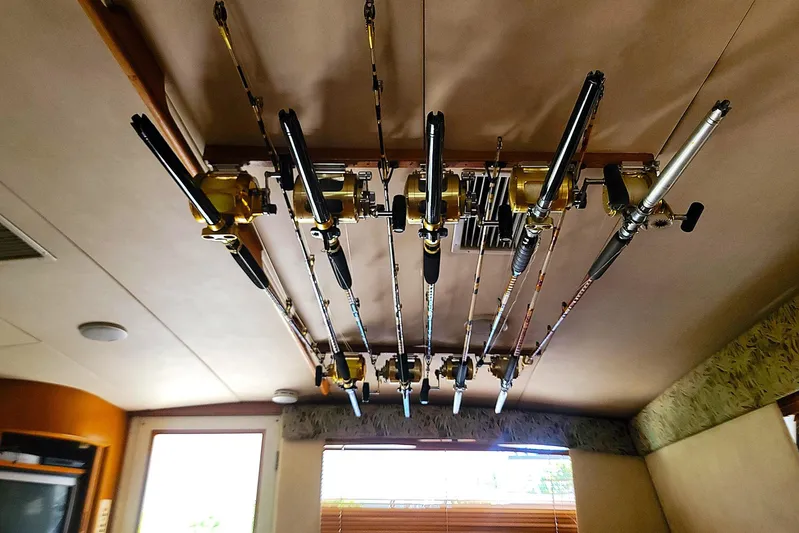 Trophy Hunter Yacht Photos Pics Fishing rods stored on ceiling of 1989 Bertram 50 Convertible boat interior.
