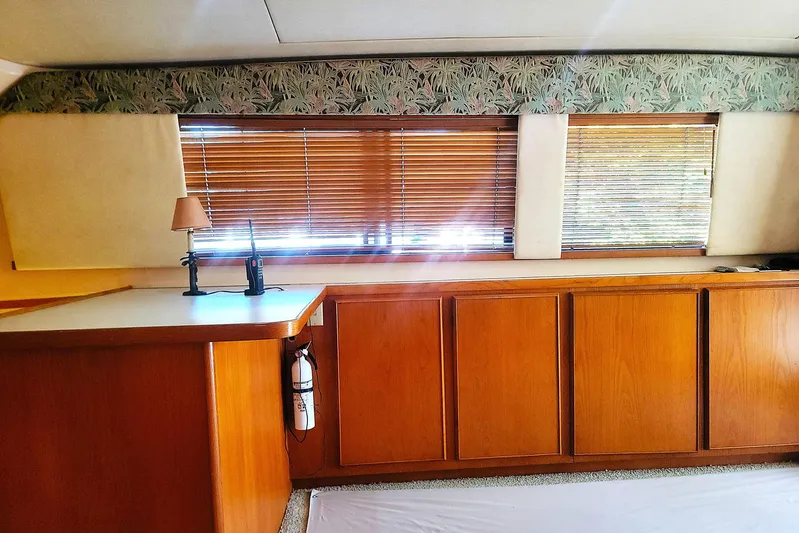 Trophy Hunter Yacht Photos Pics Interior of 1989 Bertram 50 Convertible yacht with wooden cabinets and blinds.