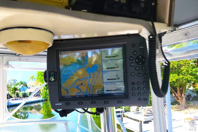 Trophy Hunter Yacht Photos Pics Garmin GPS system on 1989 Bertram 50 Convertible boat, displaying navigational map.