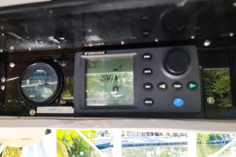 Trophy Hunter Yacht Photos Pics Control panel of a 1989 Bertram 50 Convertible boat with navigation instruments.