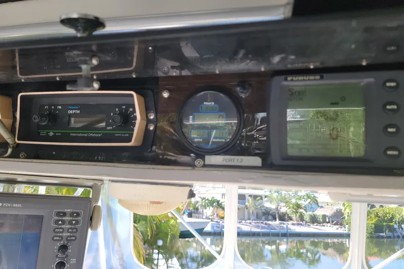 Trophy Hunter Yacht Photos Pics Boat dashboard with depth and navigation instruments on a 1989 Bertram 50 Convertible.