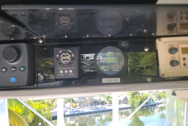 Trophy Hunter Yacht Photos Pics Control panel of a 1989 Bertram 50 Convertible yacht, featuring various navigation instruments.