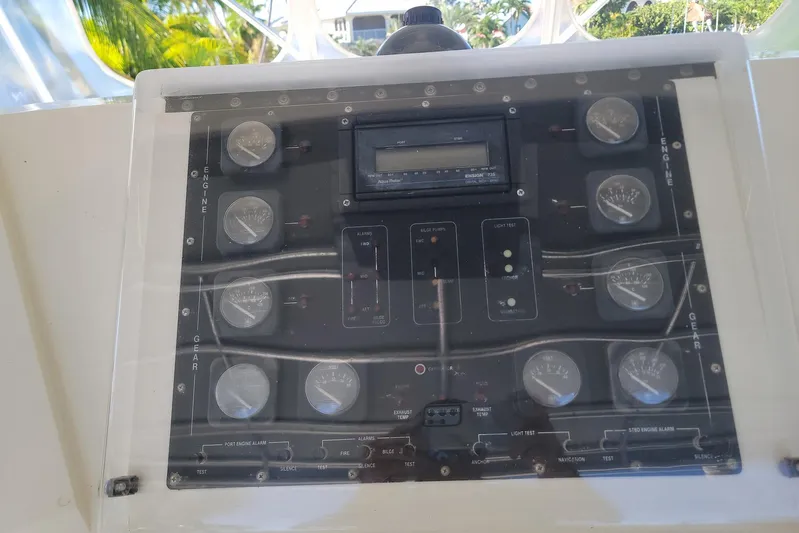 Trophy Hunter Yacht Photos Pics Control panel of a 1989 Bertram 50 Convertible boat with gauges and switches.