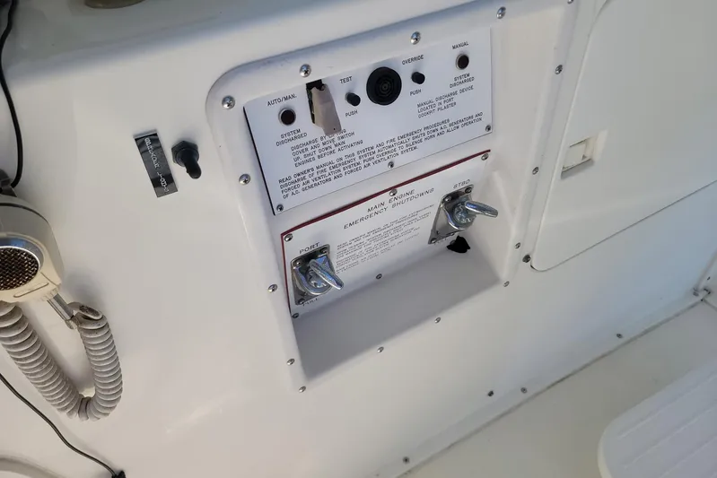 Trophy Hunter Yacht Photos Pics Control panel on a 1989 Bertram 50 Convertible yacht with emergency shutdown switches.