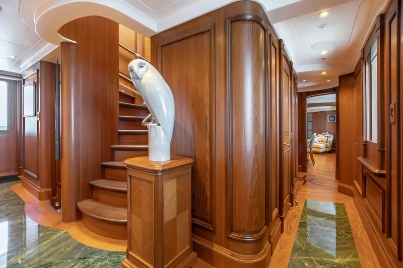 Shadowl Yacht Photos Pics Luxurious yacht interior with wooden staircase and owl sculpture, Burger Custom 2010 model.