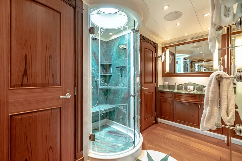 Shadowl Yacht Photos Pics Luxurious yacht bathroom with glass shower, wooden cabinetry, and elegant fixtures, 2010 Burger Custom.