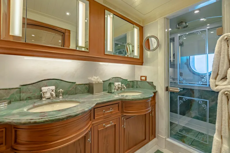 Shadowl Yacht Photos Pics Luxurious yacht bathroom with dual sinks, marble countertops, and elegant shower, 2010 Burger Custom.