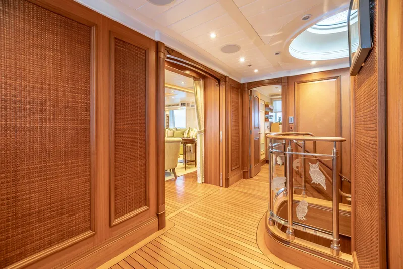 Shadowl Yacht Photos Pics Luxurious yacht interior with wooden paneling and elegant staircase, Burger Custom 2010 model.