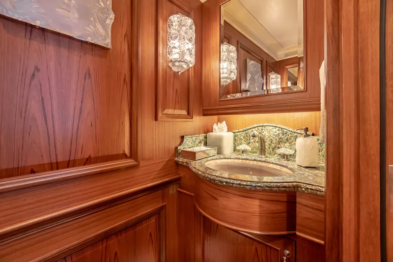 Shadowl Yacht Photos Pics Luxurious wooden bathroom with ornate sink and elegant lighting on a 2010 custom Burger model.