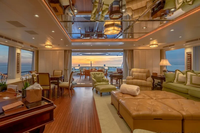 Shadowl Yacht Photos Pics Luxurious yacht interior with elegant furnishings, ocean view, and sunset ambiance, Burger Custom 2010 model.