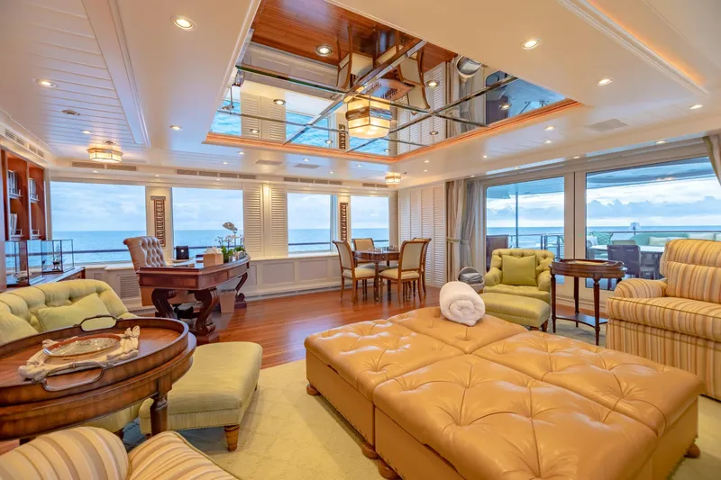 Shadowl Yacht Photos Pics Luxurious yacht interior with ocean view, featuring elegant seating and wooden accents, 2010 Burger Custom.