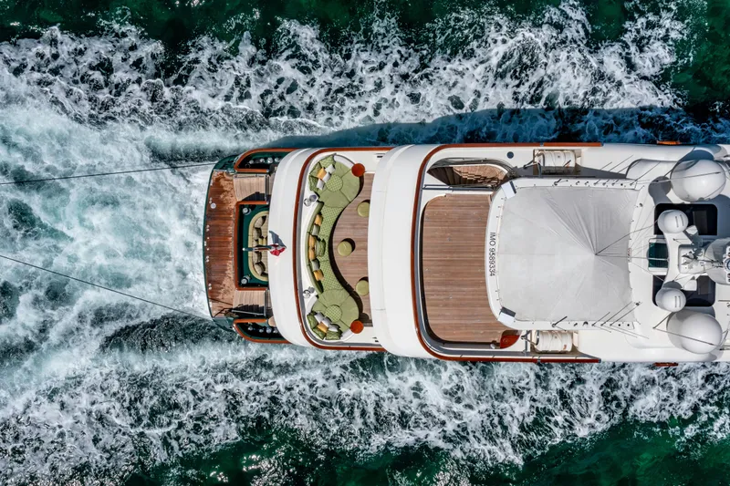 Shadowl Yacht Photos Pics Aerial view of 2010 Burger Custom yacht cruising through ocean waves.