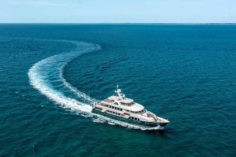 Shadowl Yacht Photos Pics Luxurious 2010 Burger Custom yacht cruising on open blue ocean waters.