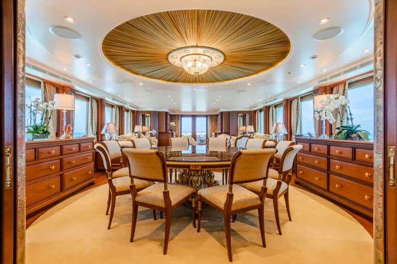 Shadowl Yacht Photos Pics Luxurious yacht interior with elegant dining area, custom woodwork, and panoramic windows, 2010 Burger model.