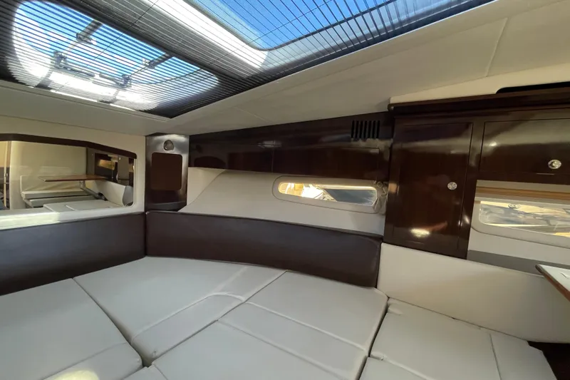  Yacht Photos Pics Interior of 2016 Sea Ray 310 Sundancer with modern furnishings and skylight.