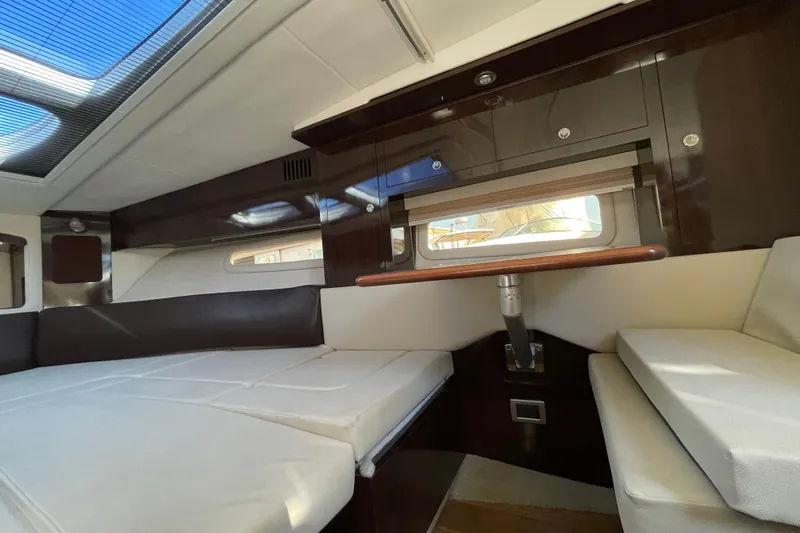  Yacht Photos Pics Interior cabin of 2016 Sea Ray 310 Sundancer with sleek design and comfortable seating.