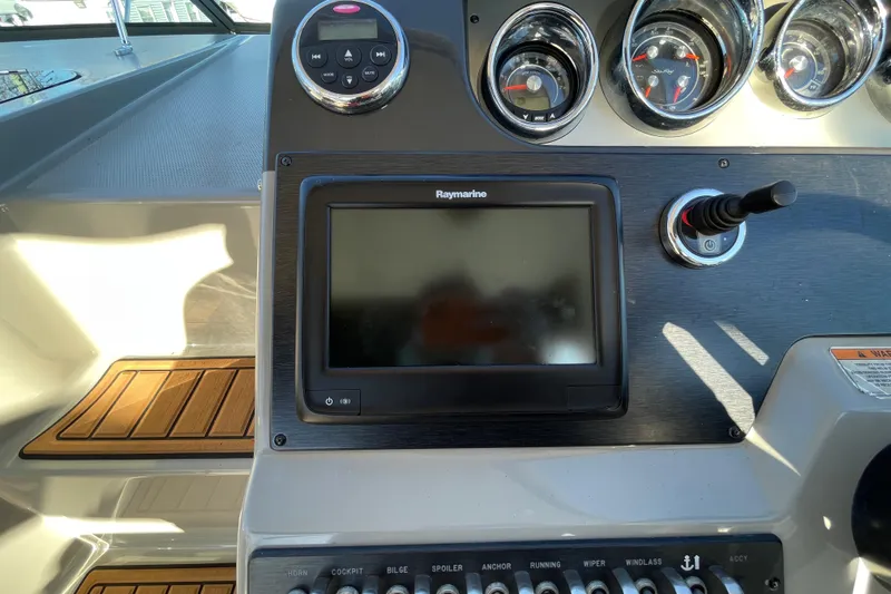  Yacht Photos Pics Control panel of 2016 Sea Ray 310 Sundancer with Raymarine display and gauges.