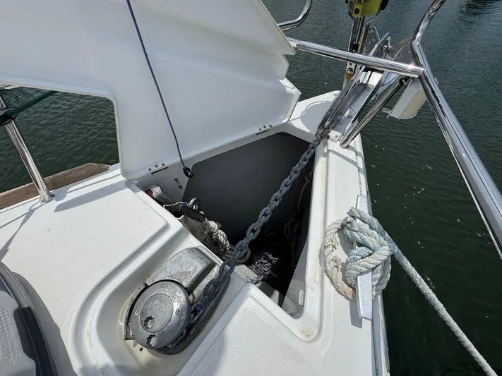 Layover Yacht Photos Pics Anchor locker of 2018 Jeanneau Sun Odyssey 389 sailboat with chain and rope.
