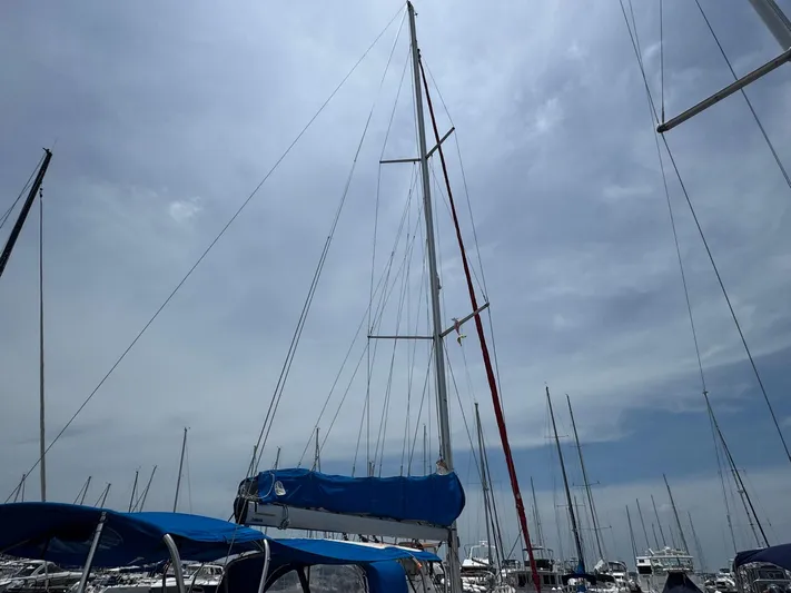 Layover Yacht Photos Pics Sailboat Jeanneau Sun Odyssey 389, 2018 model, docked under a cloudy sky.