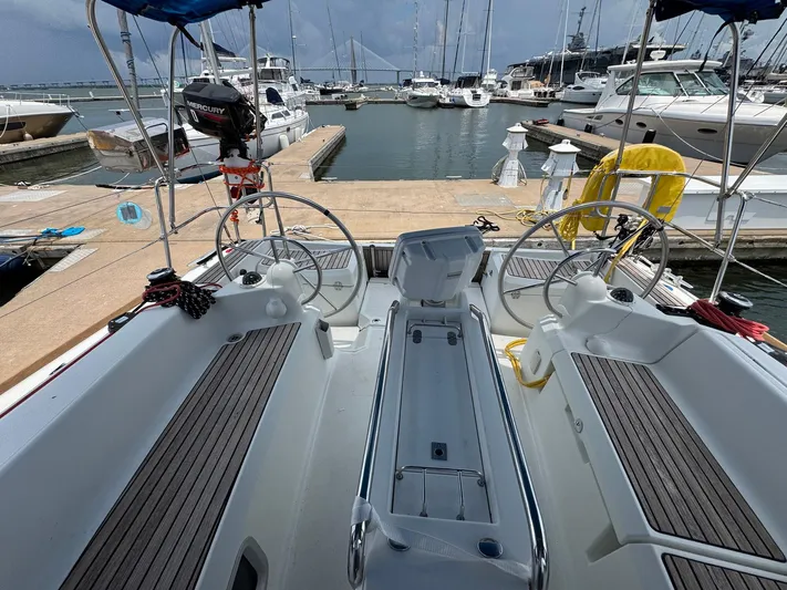 Layover Yacht Photos Pics Cockpit view of 2018 Jeanneau Sun Odyssey 389 sailboat docked at marina.