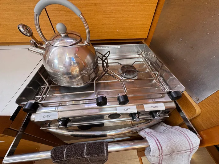 Layover Yacht Photos Pics Stovetop with kettle in Jeanneau Sun Odyssey 389 yacht kitchen, 2018 model.