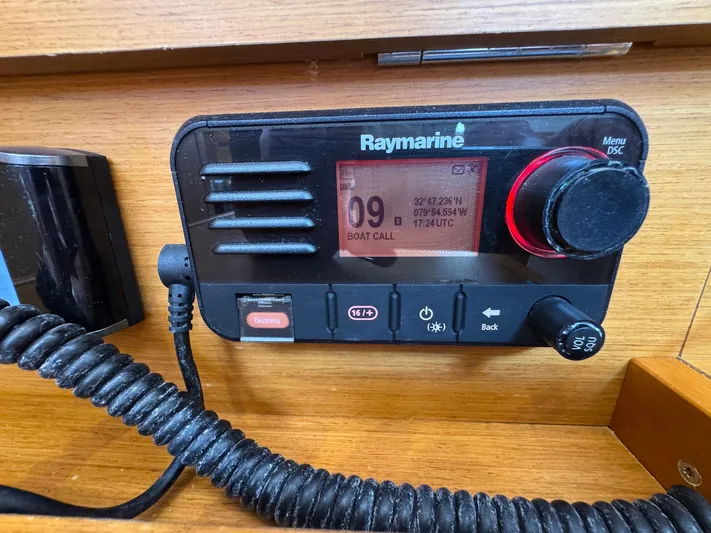 Layover Yacht Photos Pics Raymarine radio on 2018 Jeanneau Sun Odyssey 389 sailboat, displaying coordinates and boat call.