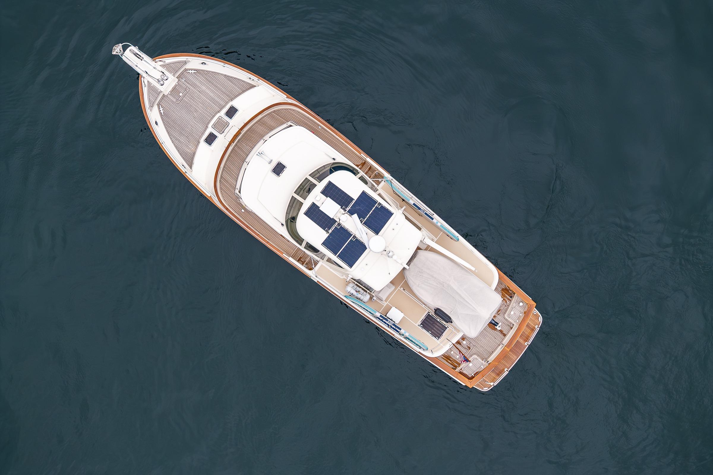 Aerial view of 2026 Fleming 55 Pilothouse yacht on calm water.