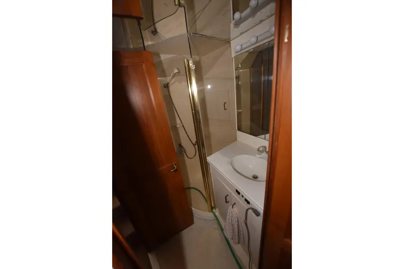 My Love Yacht Photos Pics Bathroom interior of 1993 Ocean Yachts 44 Aft Cabin with shower and sink.