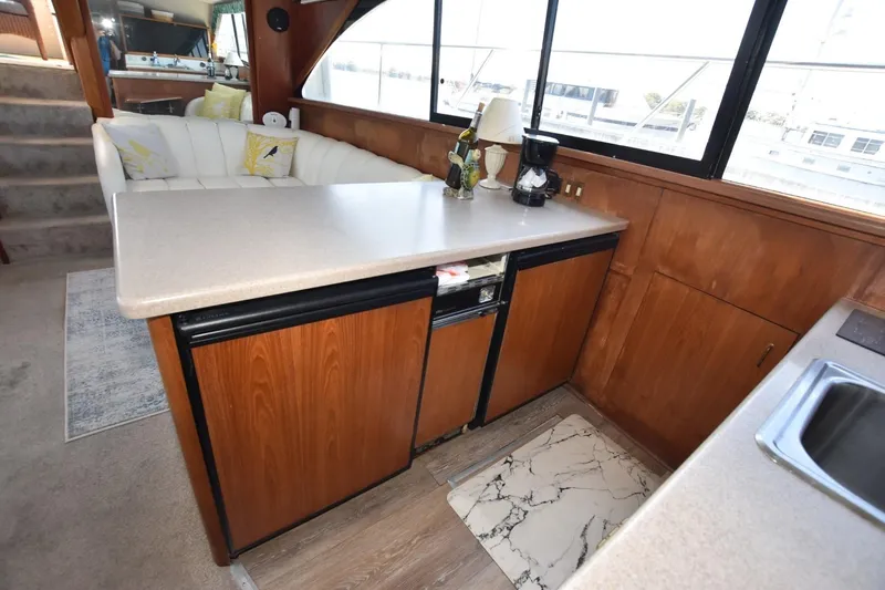 My Love Yacht Photos Pics Interior of 1993 Ocean Yachts 44 Aft Cabin with kitchen and seating area.