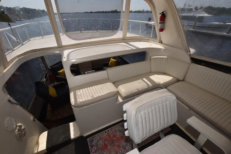 My Love Yacht Photos Pics 1993 Ocean Yachts 44 Aft Cabin interior with white seating and scenic water view.