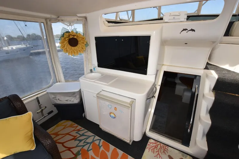 My Love Yacht Photos Pics 1993 Ocean Yachts 44 Aft Cabin interior with sink, decor, and stairs.
